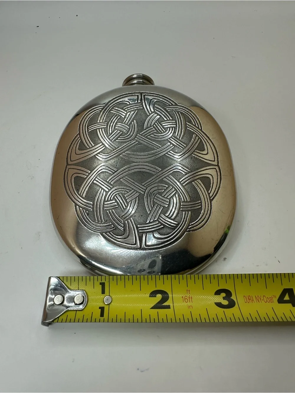 Scottish Piper Pewter Flask with Celtic Knot Design.